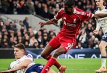 Alexander Isak comes under a challenge from Van de Ven