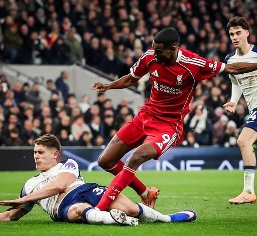 Alexander Isak comes under a challenge from Van de Ven