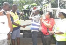 • Mr Anyetei (second from left) handing over the motorbikes to Mr Okumetey. With them is Ms Ocloo Photo: Victor A. Buxton