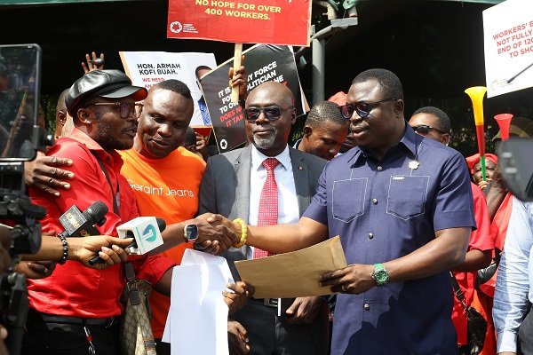 • Mr Gabriel Madobi (left) presenting the petition on behalf of the Association to Mr Emmanuel Kwamena Anyimah (right), Deputy CEO, Minerals Commission Photo: Ebo Gorman