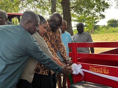 • Ms Myriam Montrat (middle), Mr Opoku (third from left) cutting a ribbon to officially hand over the equipment