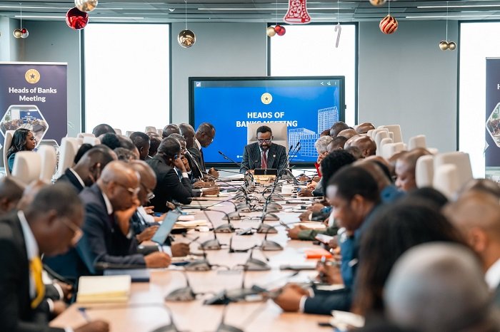 • Dr Asiama (head of table) speaking at the meeting