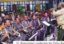 Fr Bonaventure conducting the Police Band