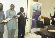 Justice Isaac Addo (right) swearing in the newly elected executives of the GhCCI at the AGM. Photo. Ebo Gorman