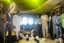Maame Efua Houadjeto (fifth from right) with other dignitaries unveiling the anniversary logo