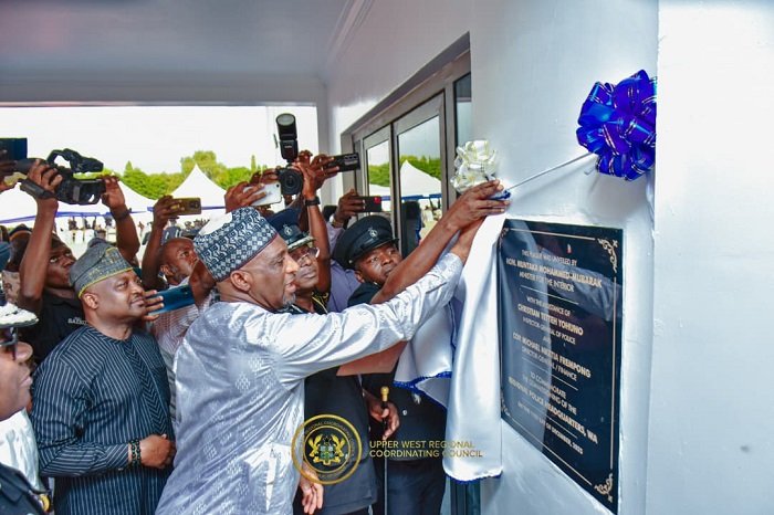 • Alhaji Muntaka unveiling a plaque at the commissioning of the Police Headquaters