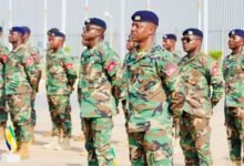 The troops in a parade ahead of their departure