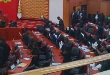 Members of the Minority Caucus, chanting on the floor of Parliament as a way of expressing their displeasure