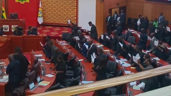 Members of the Minority Caucus, chanting on the floor of Parliament as a way of expressing their displeasure