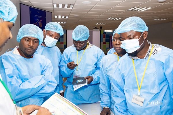 Journalists being taken through printing processes at Margins
