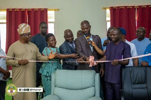 • Mr Awoki Panassa (middle) cutting the tape to officially inaugurate the studio. With him are other diplomats and some members of the hospital management