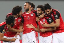 Mohamed Salah celebrates a goal with his teammates