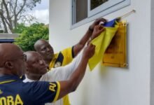 • Mr Boateng, Rev. Fr Ohene and Mr Agyekum unveiling a plaque at the handing over ceremony