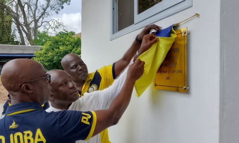 • Mr Boateng, Rev. Fr Ohene and Mr Agyekum unveiling a plaque at the handing over ceremony