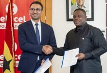 Mr Damush (left) and Mr George exchanging the signed MoU