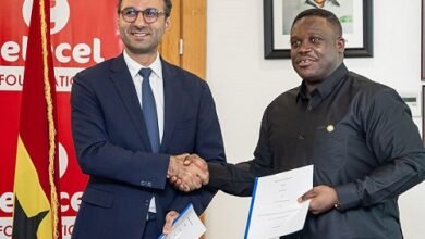 Mr Damush (left) and Mr George exchanging the signed MoU