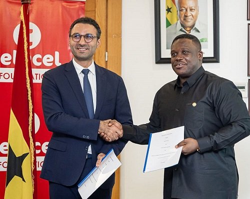 Mr Damush (left) and Mr George exchanging the signed MoU