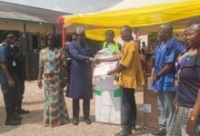 Mr Ibrahim (third from left), presenting a certificate to Mr Akaachiak, the overall best farmer at Ayawaso East Municipal Assembley
