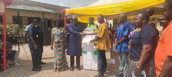 Mr Ibrahim (third from left), presenting a certificate to Mr Akaachiak, the overall best farmer at Ayawaso East Municipal Assembley