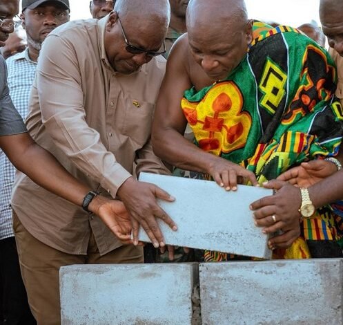 • President Mahama being assisted by Togbui Afede XIV to lay the foundation block