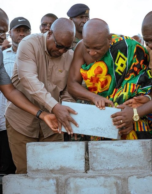 • President Mahama being assisted by Togbui Afede XIV to lay the foundation block