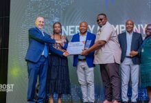 Officials of BOST Energies receiving the award