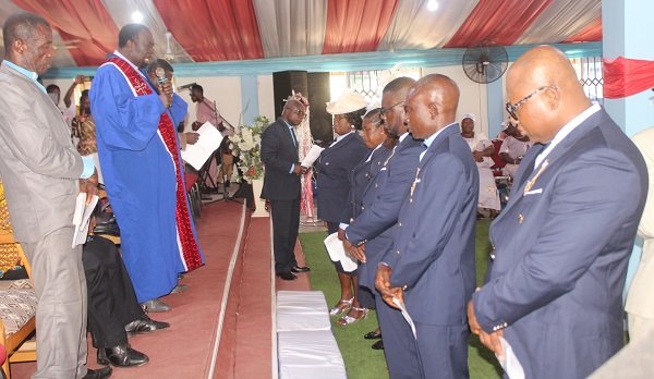 • Apostle Daniel Adu Asare (with mic) praying for the pastors at the ordination ceremony Photo: Ebo Gorman