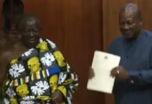 • President Mahama (right) with Otumfuo Osei Tutu after receiving the report