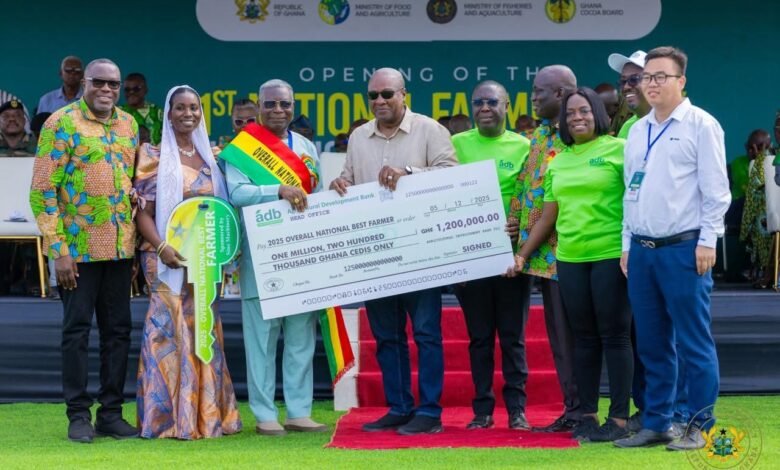 President Mahama (sixth from right) presenting the overall National Best Farmer dummy cheque to Mr Abraham Kwaku Adusei (third from left)