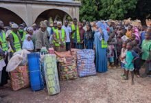 Officials of Sadaqat Train donating items to Tambokurugu community