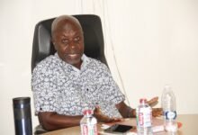 Mr Kersi (inset) addressing the meeting