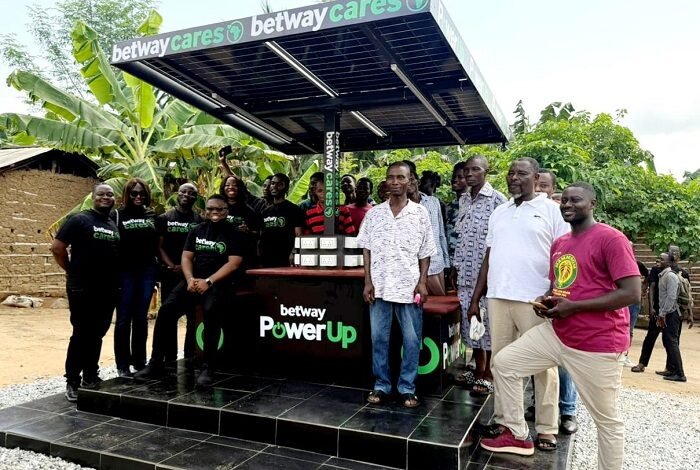 • Residents and Betway officials standing by the power up