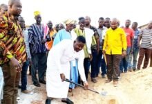 Mr Atta Issah with the shovel breaking ground for work to kick-start at the project site