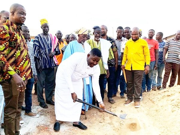 Mr Atta Issah with the shovel breaking ground for work to kick-start at the project site