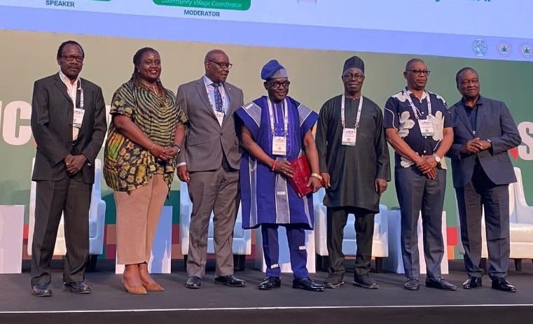 Mr Luc Bodea, Director of ICASA (middle) in a group photograph with other speakers at the event