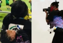 Ghanaian photography journalist, Senyuiedzorm Awusi Adadevoh captured with a baby strapped to her back as she goes about her usual business. Photo credit: Adadevoh/Facebook.com Source: