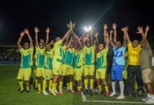 • Members of the victorious junior officers’ team celebrating with the trophy while Mr Amadu, flanked by some guests, addressed the gathering
