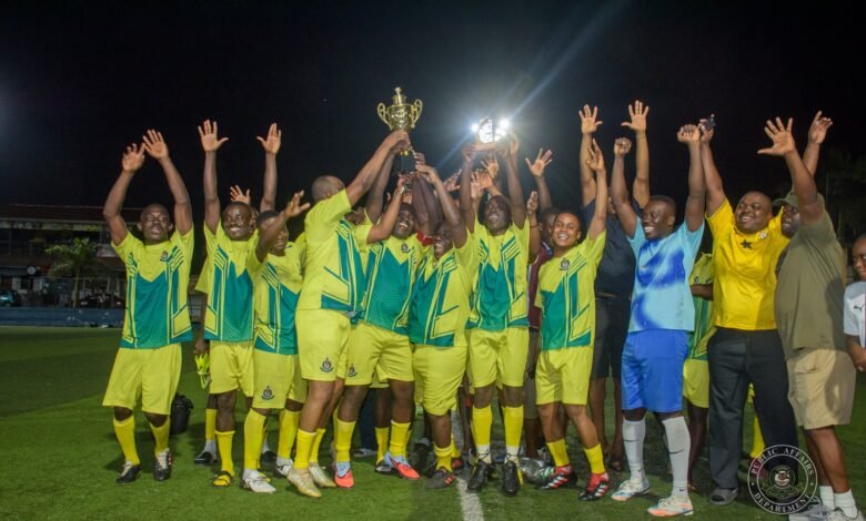 • Members of the victorious junior officers’ team celebrating with the trophy while Mr Amadu, flanked by some guests, addressed the gathering