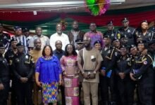 Ms Linda Ocloo(fourth from left, front row) with the security officials after the programme