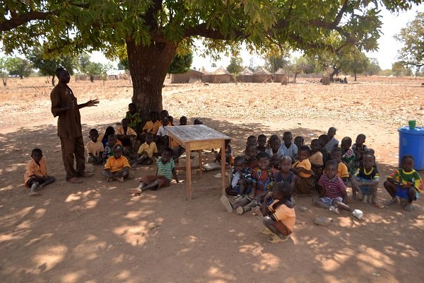 • Classes in session under a tree