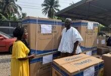 • Mr Ibrahim presenting a deep freezer to a beneficiary