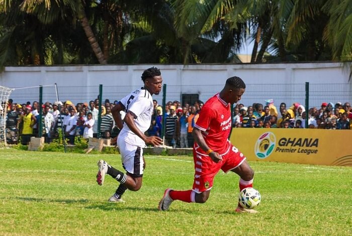 • A Kotoko player (in red) marked closely by a Swedru All Blacks player