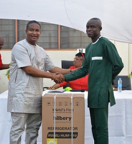 Mr Ramadan(left)presenting the overall best worker award to Mr Abdul Fatawa Rahman.