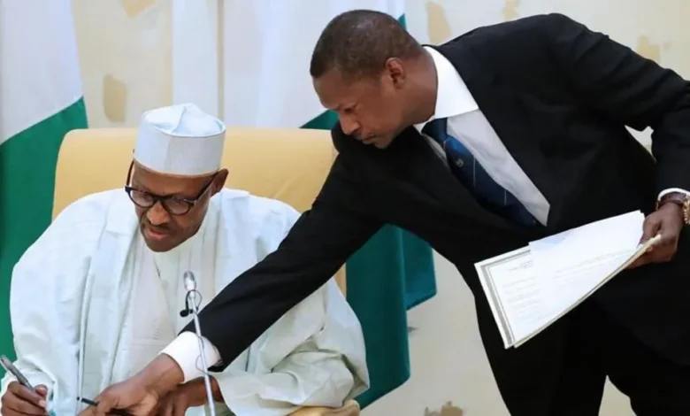 • Abubakar Malami (right) with late former President Buahari