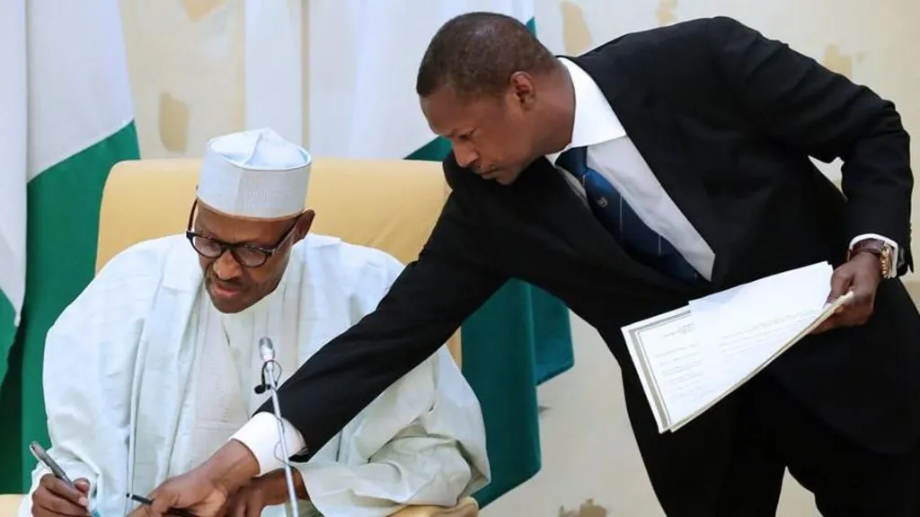 • Abubakar Malami (right) with late former President Buahari