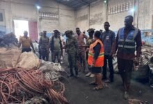 Ms Ocloo with some MCEs and National Security inspecting a company alleged to be buying stolen cables