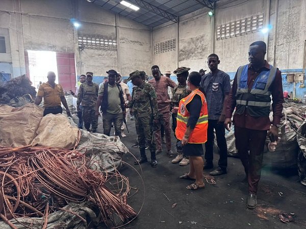Ms Ocloo with some MCEs and National Security inspecting a company alleged to be buying stolen cables