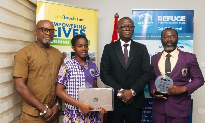 • Ama Korama Adu with the Minister of Sports and Recreation, Mr Kofi Adams, after the presentation. With them are Mr Moses Adu (right), father and coach of the player and Mr Samuel Anim Addo (left)