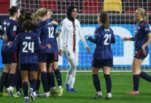 Arsenal players celebrating a goal during the game