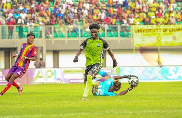 Asare (down) dives to make a save to deny striker Salifu a chance at goal